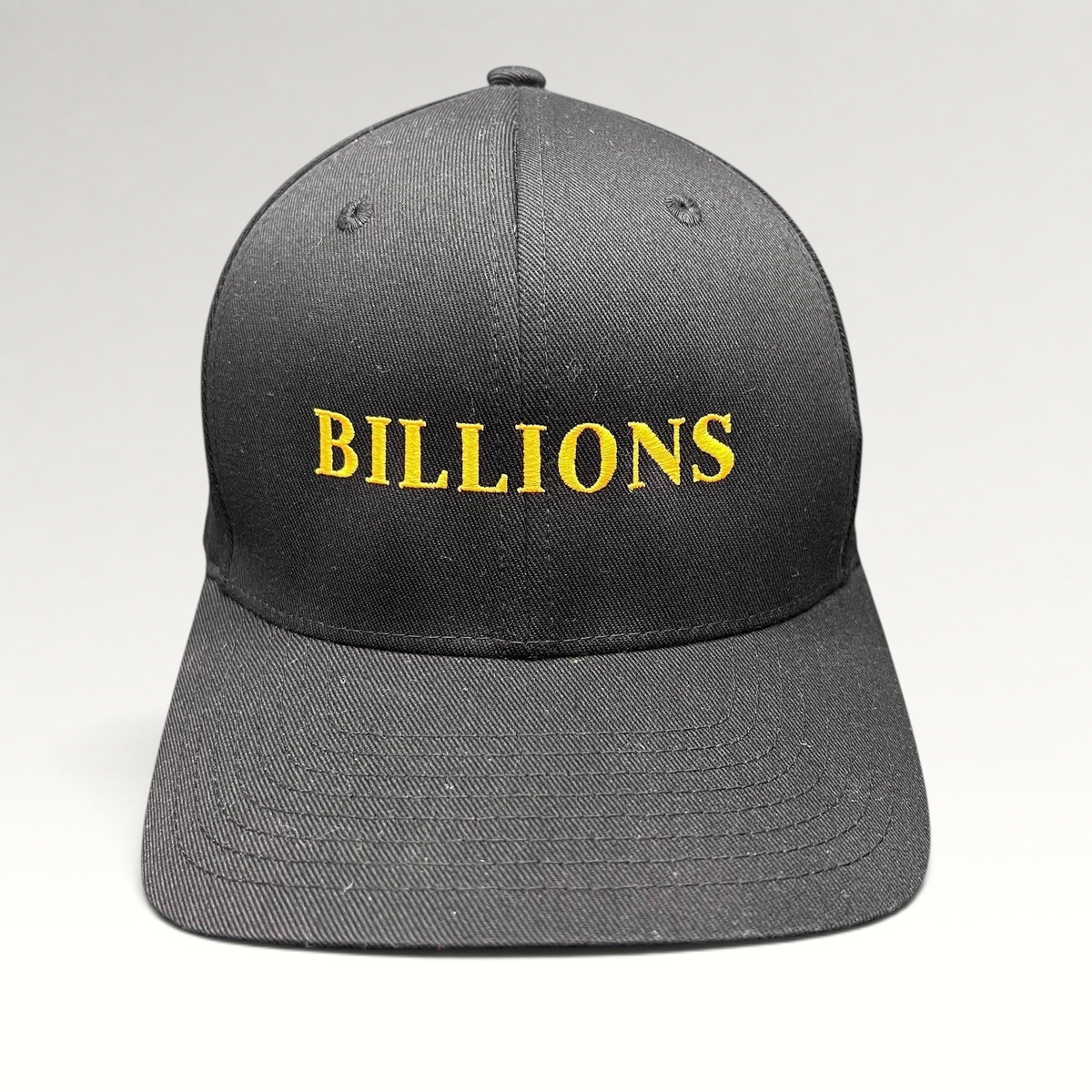 Raree Finds Billions TV show promotional black Yupoong Flexfit hat with gold embroidered logo