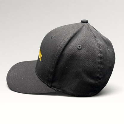 Raree Finds Billions TV show promotional black Yupoong Flexfit hat with gold embroidered logo on a structured crown