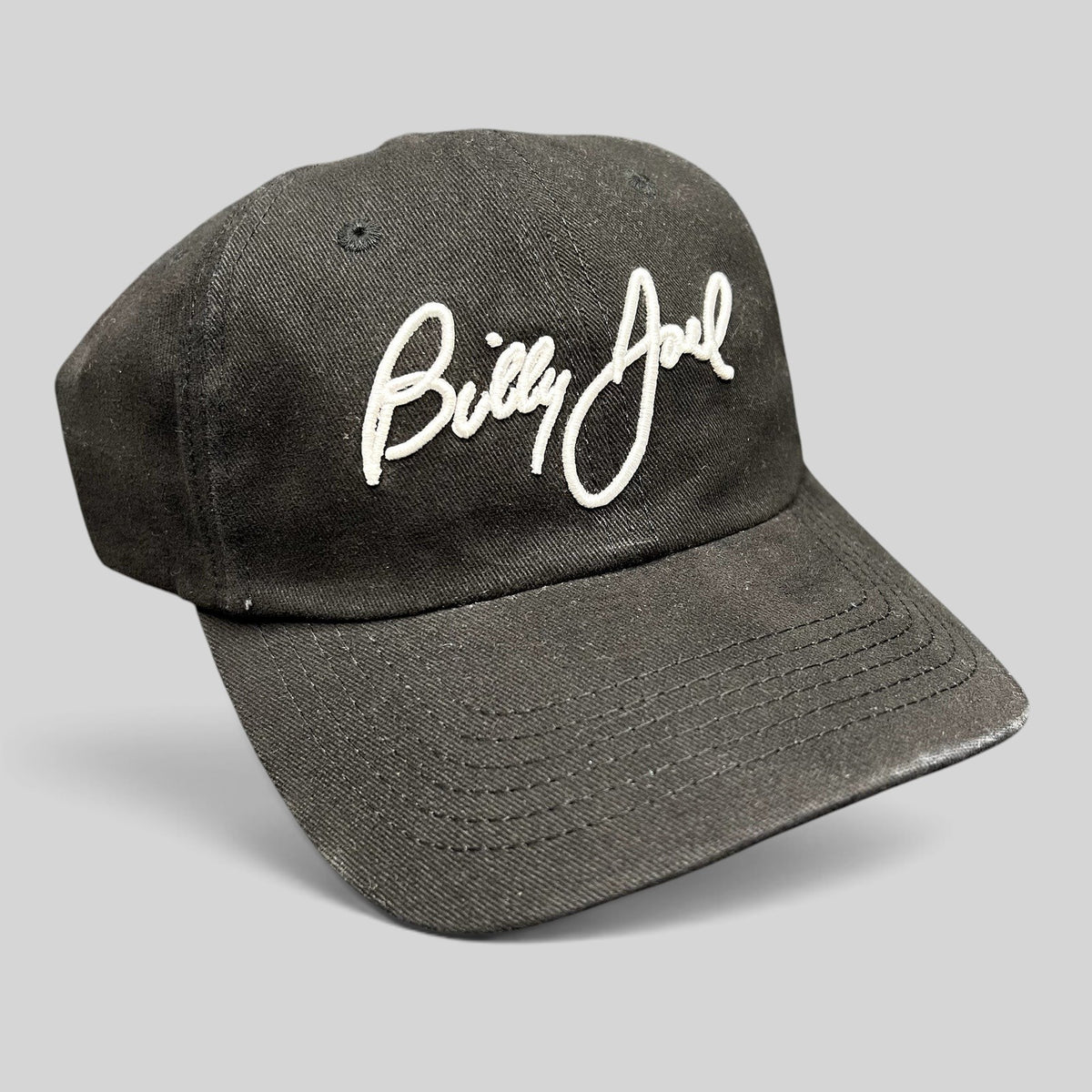 Raree Finds black Billy Joel concert strapback hat with white script embroidery on the front crown