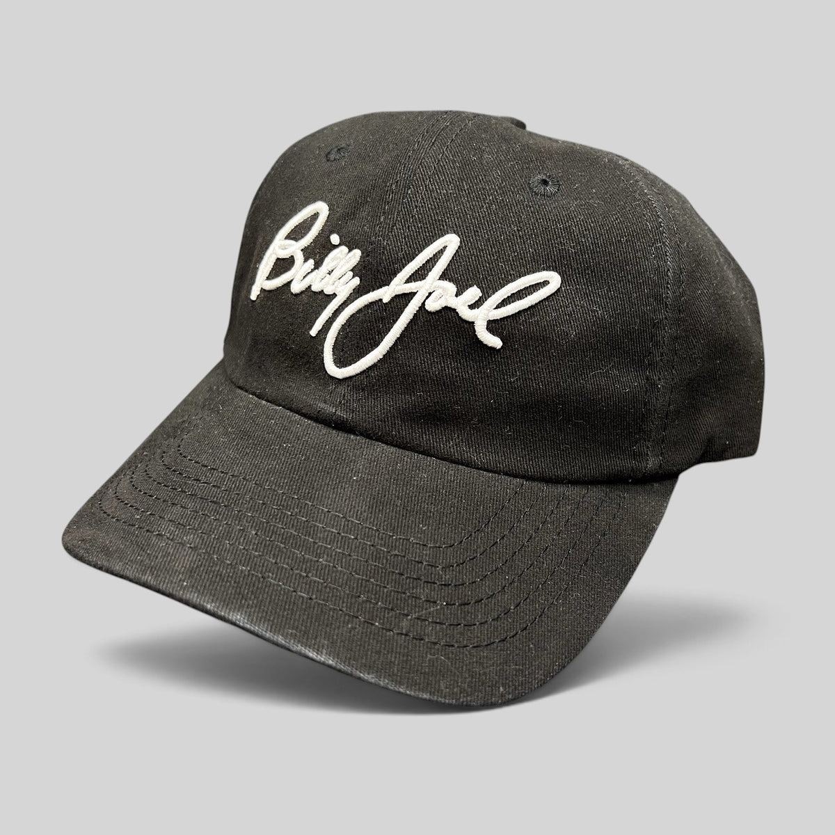 Raree Finds black Billy Joel In Concert strapback hat with white script embroidery on the front crown