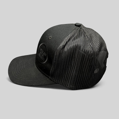 Raree Finds black American Music Awards trucker hat with tonal embroidered logo and breathable mesh back panel.