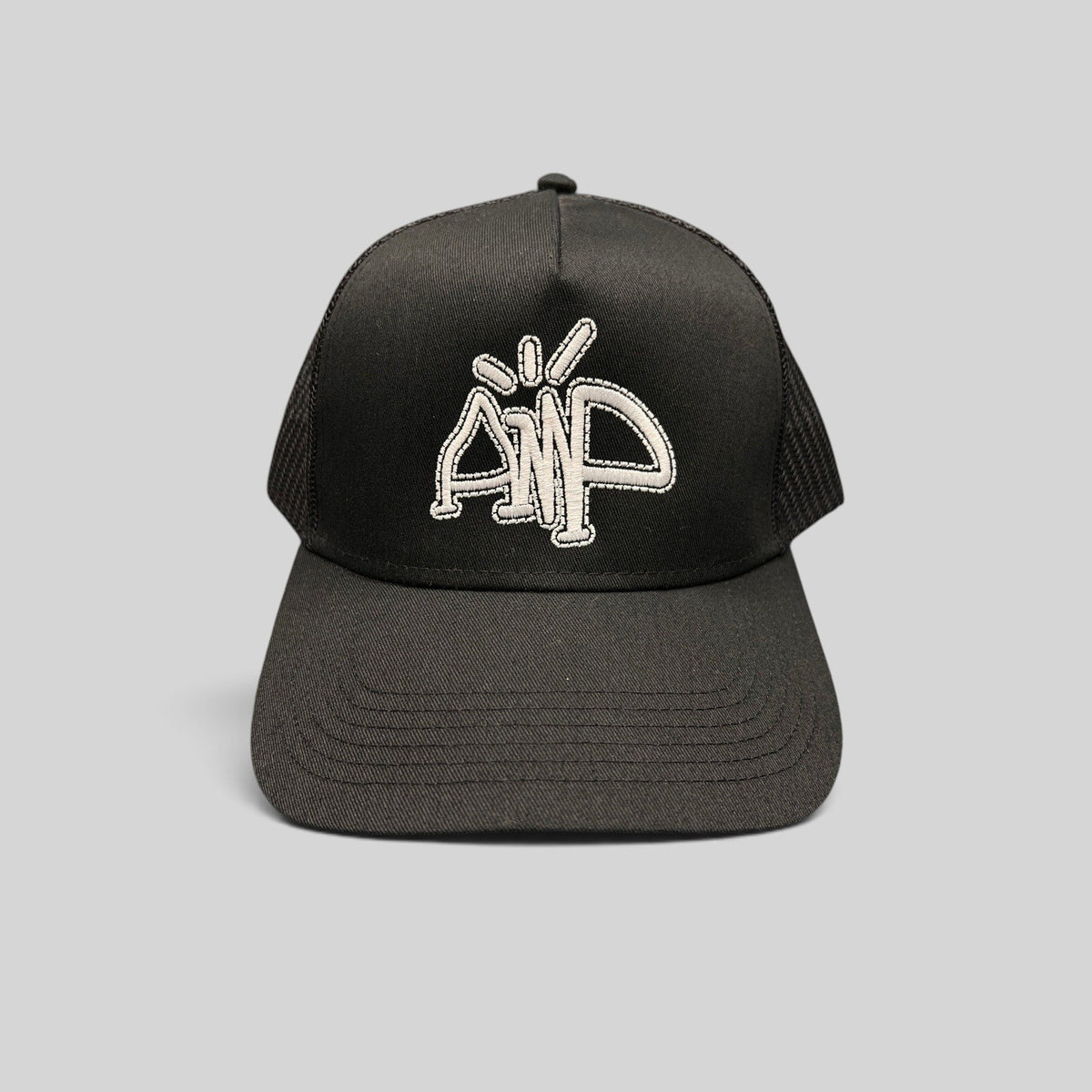 Raree Finds black mesh trucker hat with white embroidered AMP logo and adjustable snapback closure