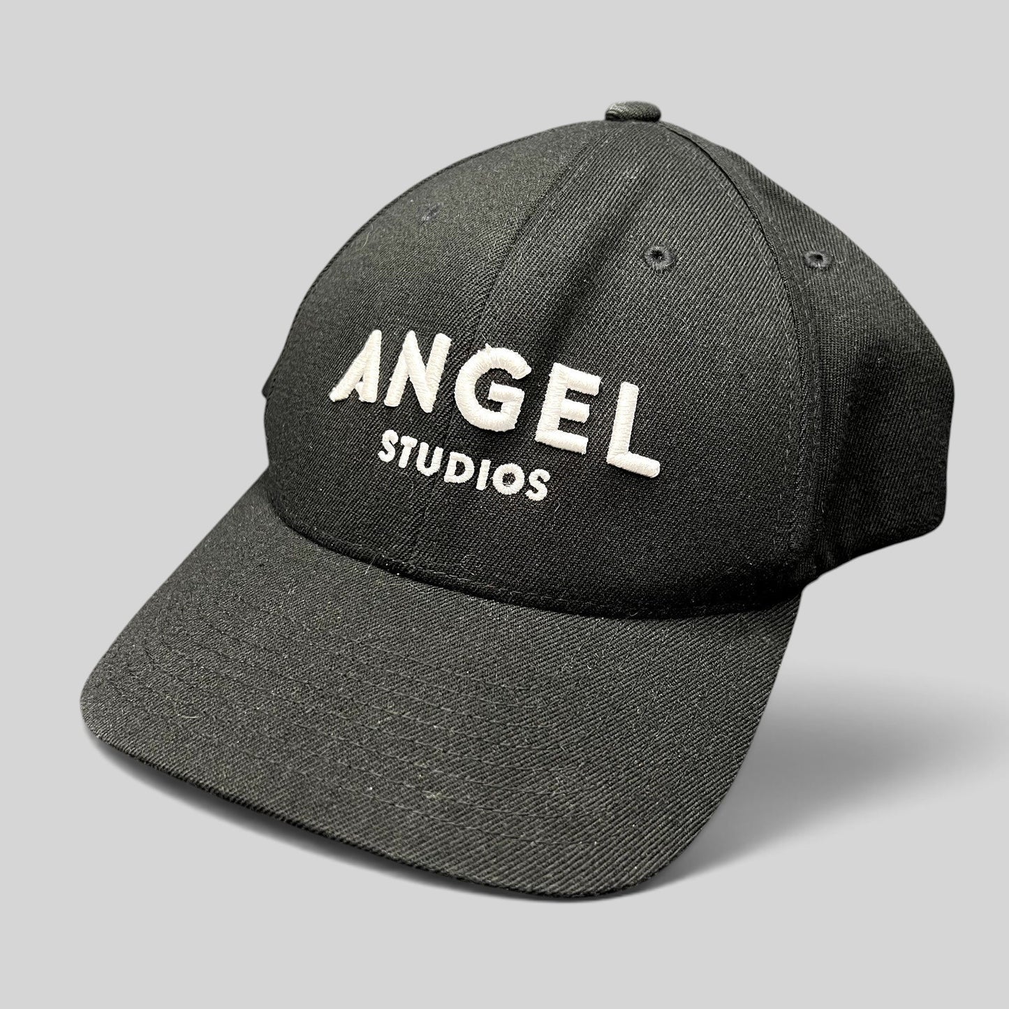 Raree Finds black Flexfit cap with white embroidered Angel Studios logo on a structured crown and curved brim