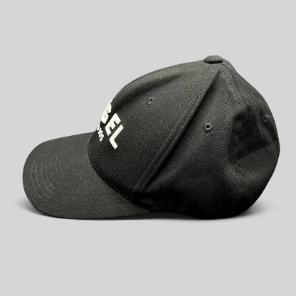 Raree Finds black Flexfit cap with white embroidered Angel Studios logo and curved brim, side profile view.