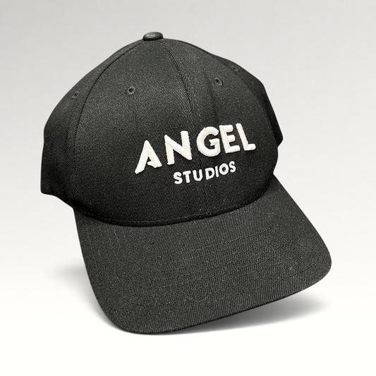 Raree Finds black Flexfit cap with white embroidered Angel Studios logo on a structured crown and curved brim