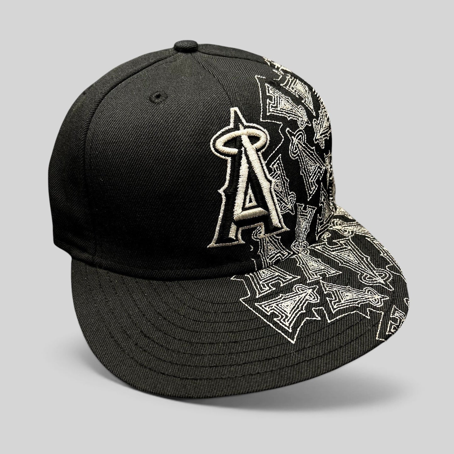 Raree Finds black New Era 59FIFTY Los Angeles Angels fitted hat with silver embroidered logo and side brim pattern