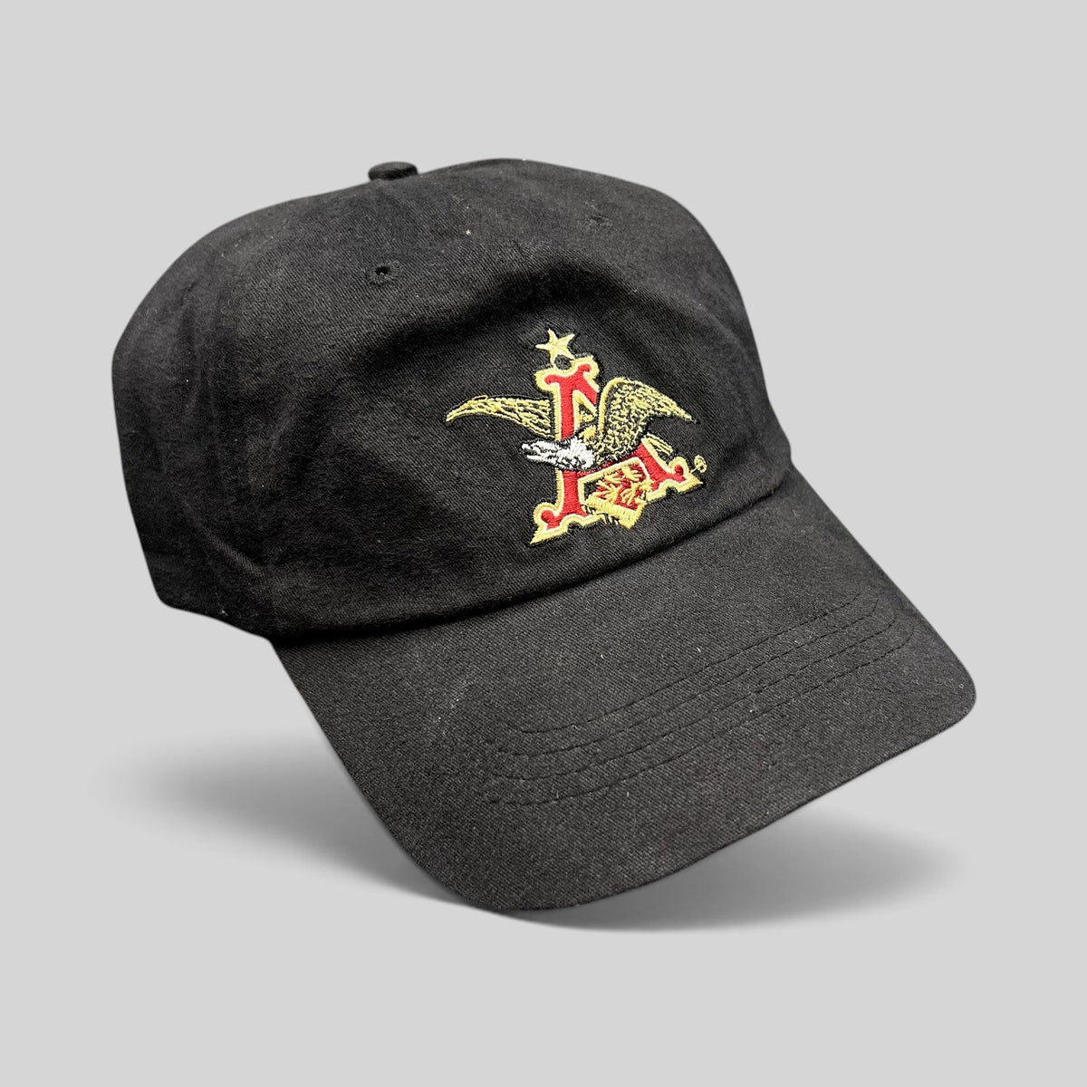 Raree Finds black cotton strapback dad cap featuring an embroidered Anheuser-Busch A and Eagle logo