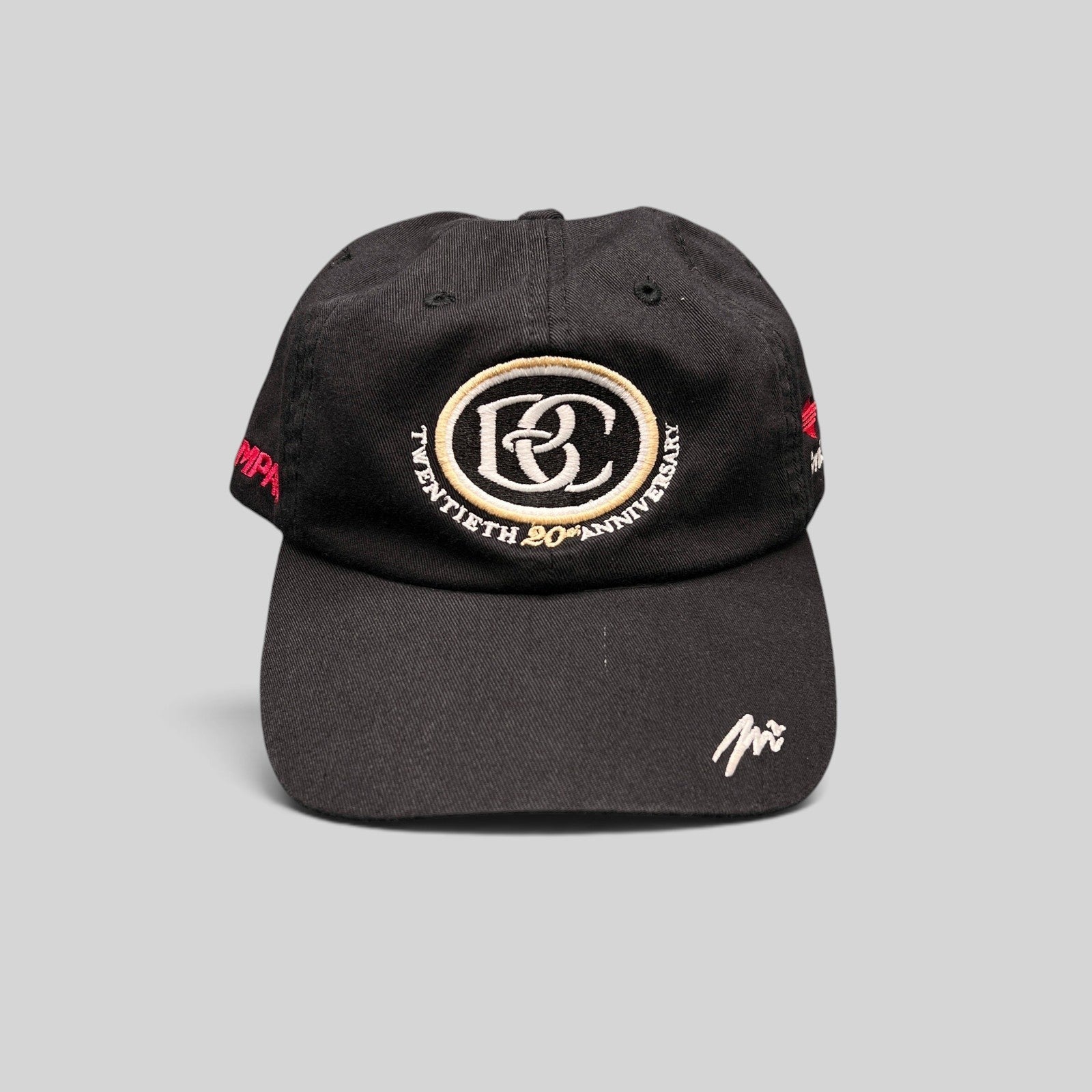 Raree Finds black unstructured cotton hat featuring a BC 20th anniversary emblem and Sprint side embroidery.