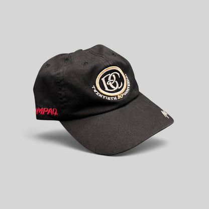 Raree Finds black cotton unstructured hat featuring a cream and black BC 20th anniversary logo and side embroidery.