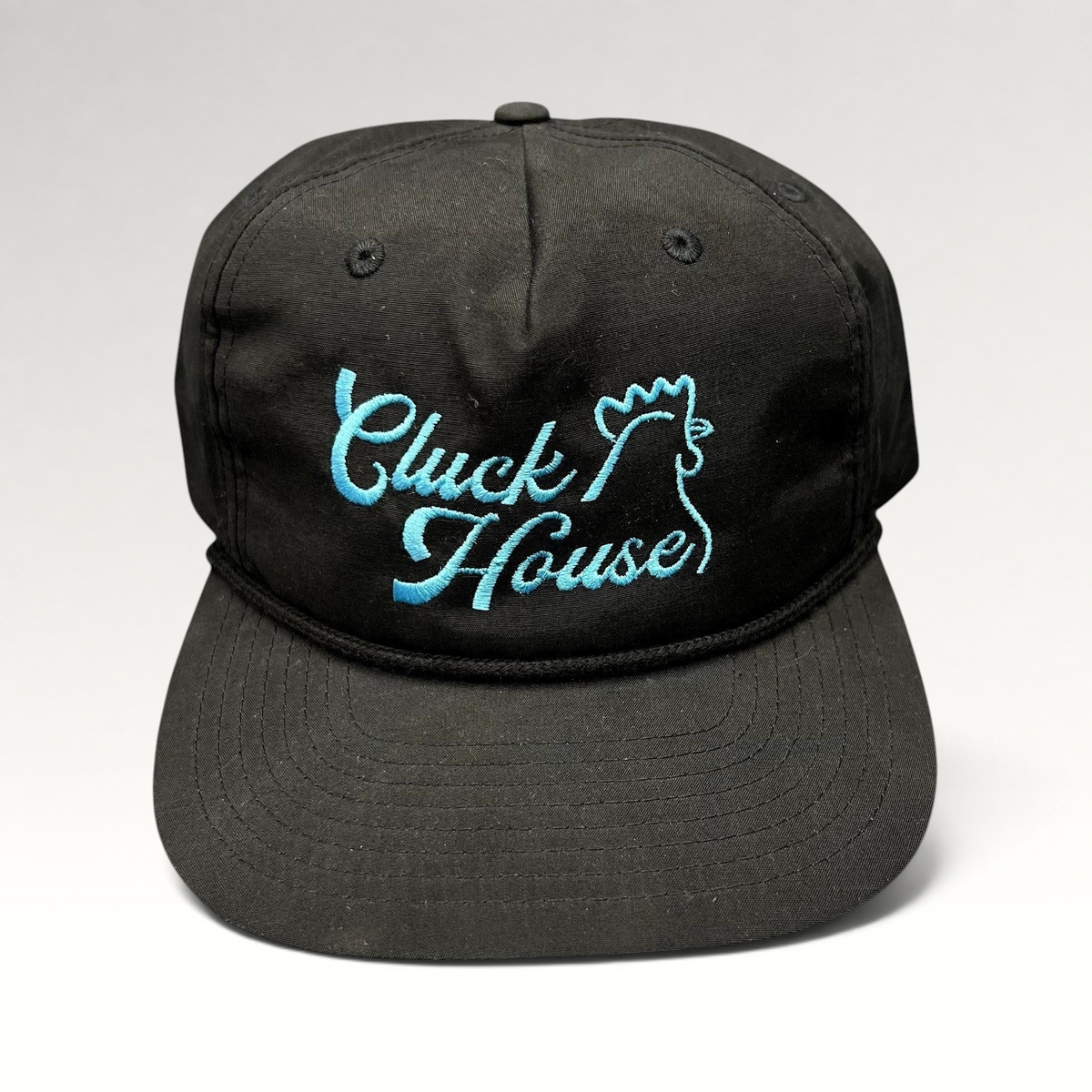 Raree Finds black Richardson Outdoor snapback hat with aqua blue Cluck House script embroidery and front rope detail.