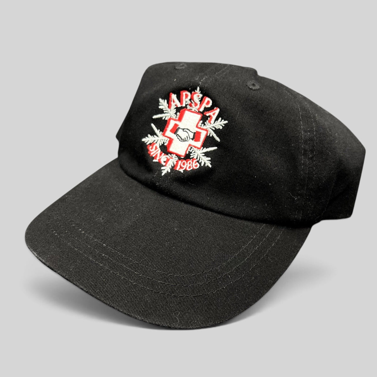 Raree Finds vintage black cotton ASPA Ski Patrol cap with embroidered cross logo and Since 1946 text