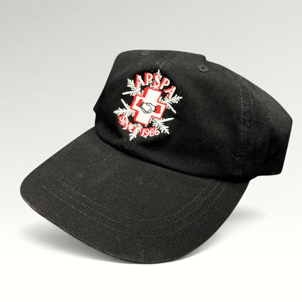 Raree Finds vintage black cotton ASPA Ski Patrol cap with embroidered cross logo and Since 1946 text
