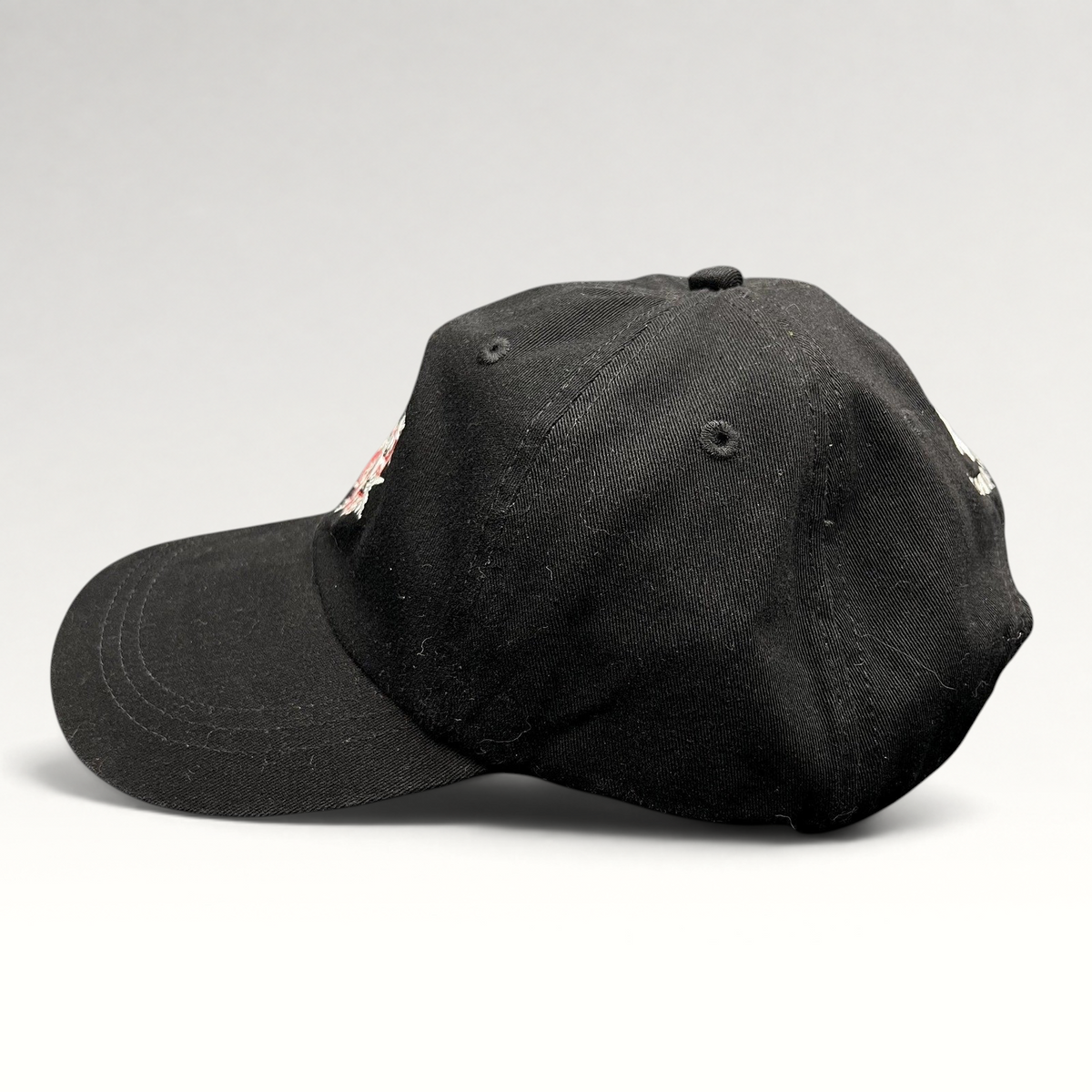Raree Finds vintage black Ouray Sportswear ASPA Ski Patrol strapback hat with embroidered front and rear logo details.