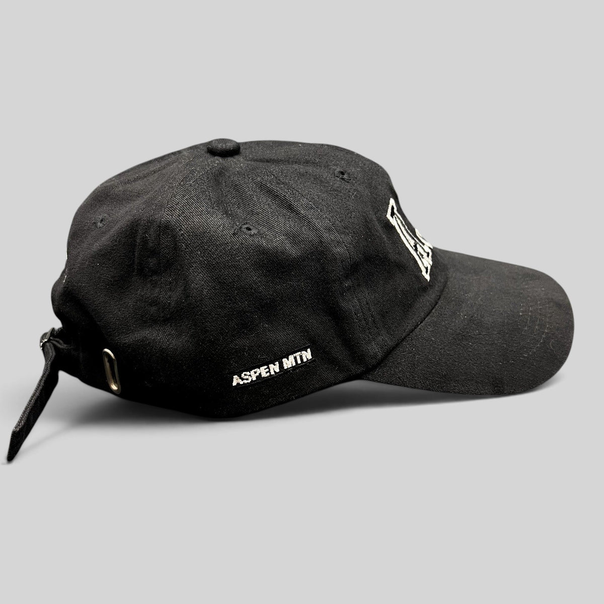 Raree Finds black cotton strapback hat with white AJAX embroidery and Aspen Mtn side detail