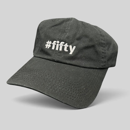 Raree Finds black cotton strapback hat with white #fifty embroidery, celebrating the Aspen 2017 anniversary.