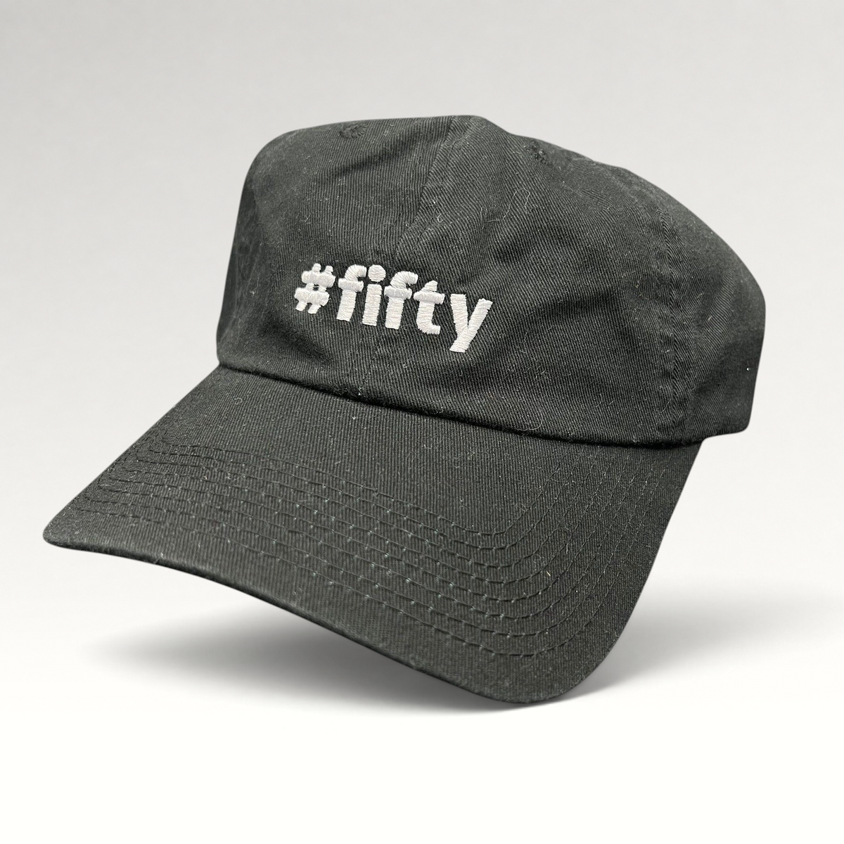 Raree Finds black cotton strapback hat with white #fifty embroidery, celebrating the Aspen 2017 anniversary.