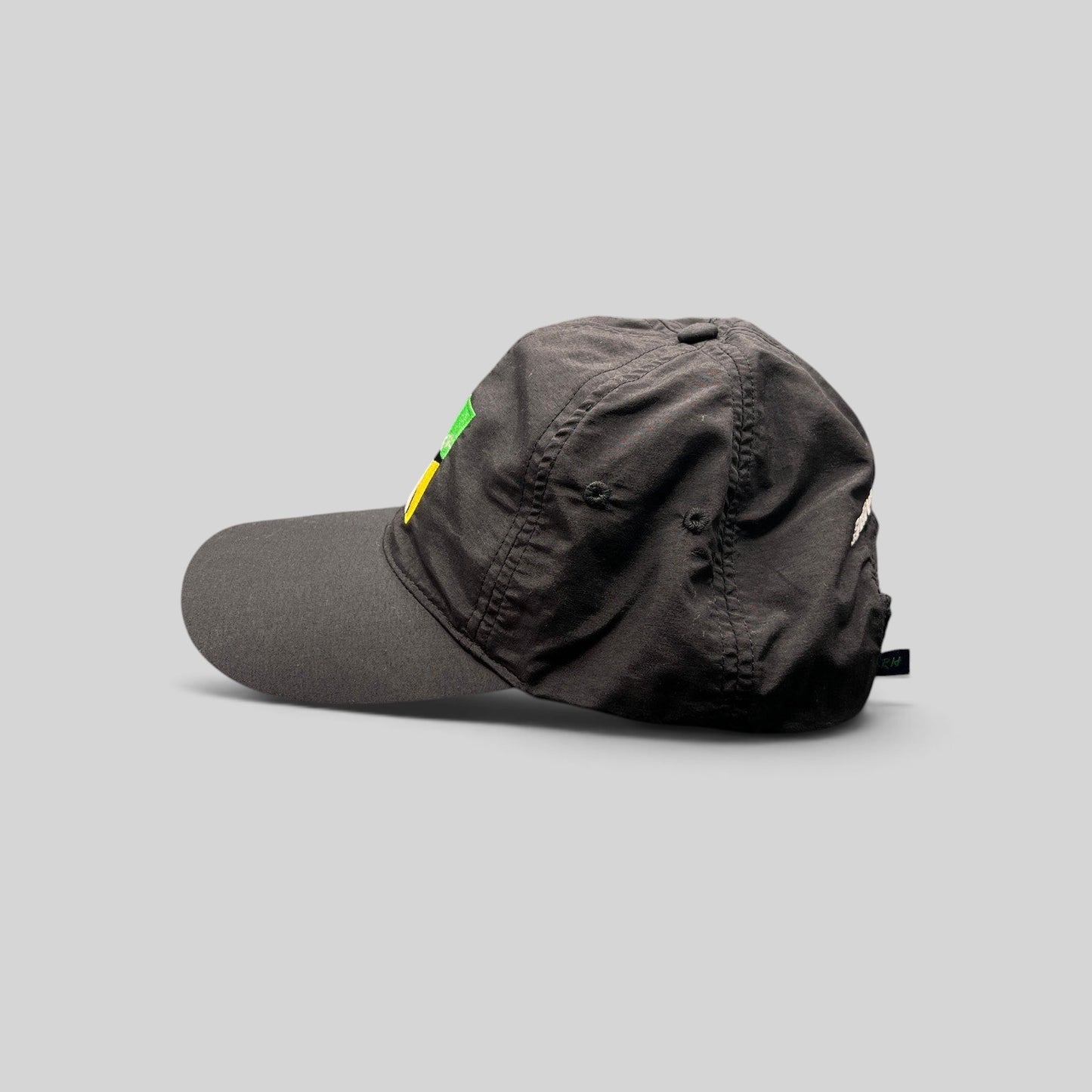 Raree Finds black unstructured strapback hat with Aspen Ideas Festival logo and Ernst & Young sponsor embroidery.