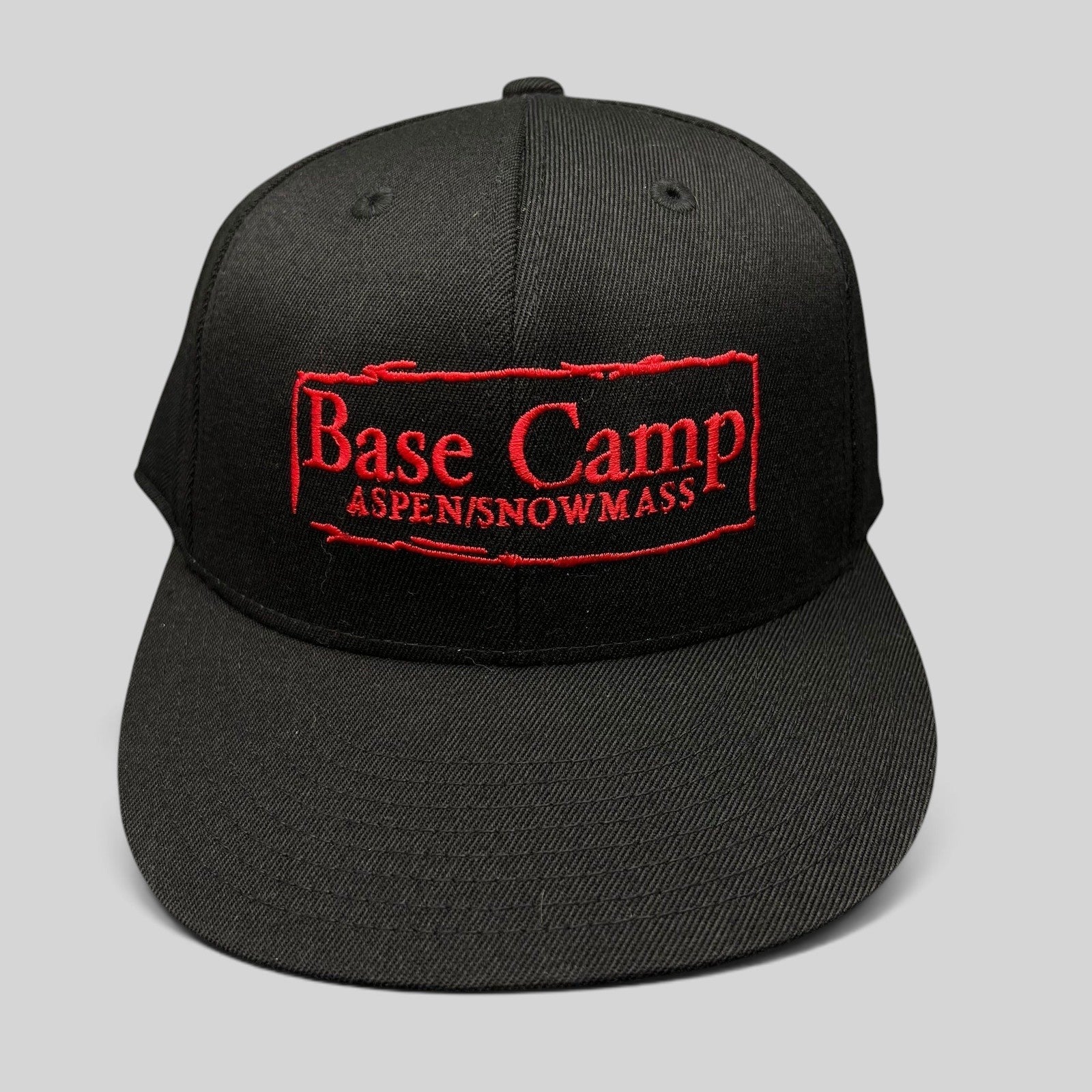 Raree Finds black Flexfit 210 fitted cap with red Base Camp Aspen Snowmass embroidered logo on the front
