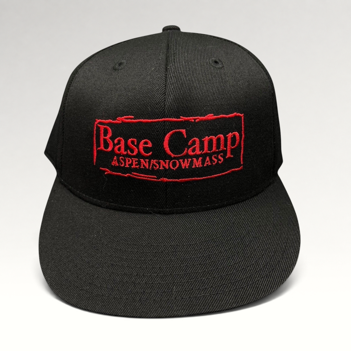 Raree Finds black Flexfit 210 fitted cap with red Base Camp Aspen Snowmass embroidered logo on the front