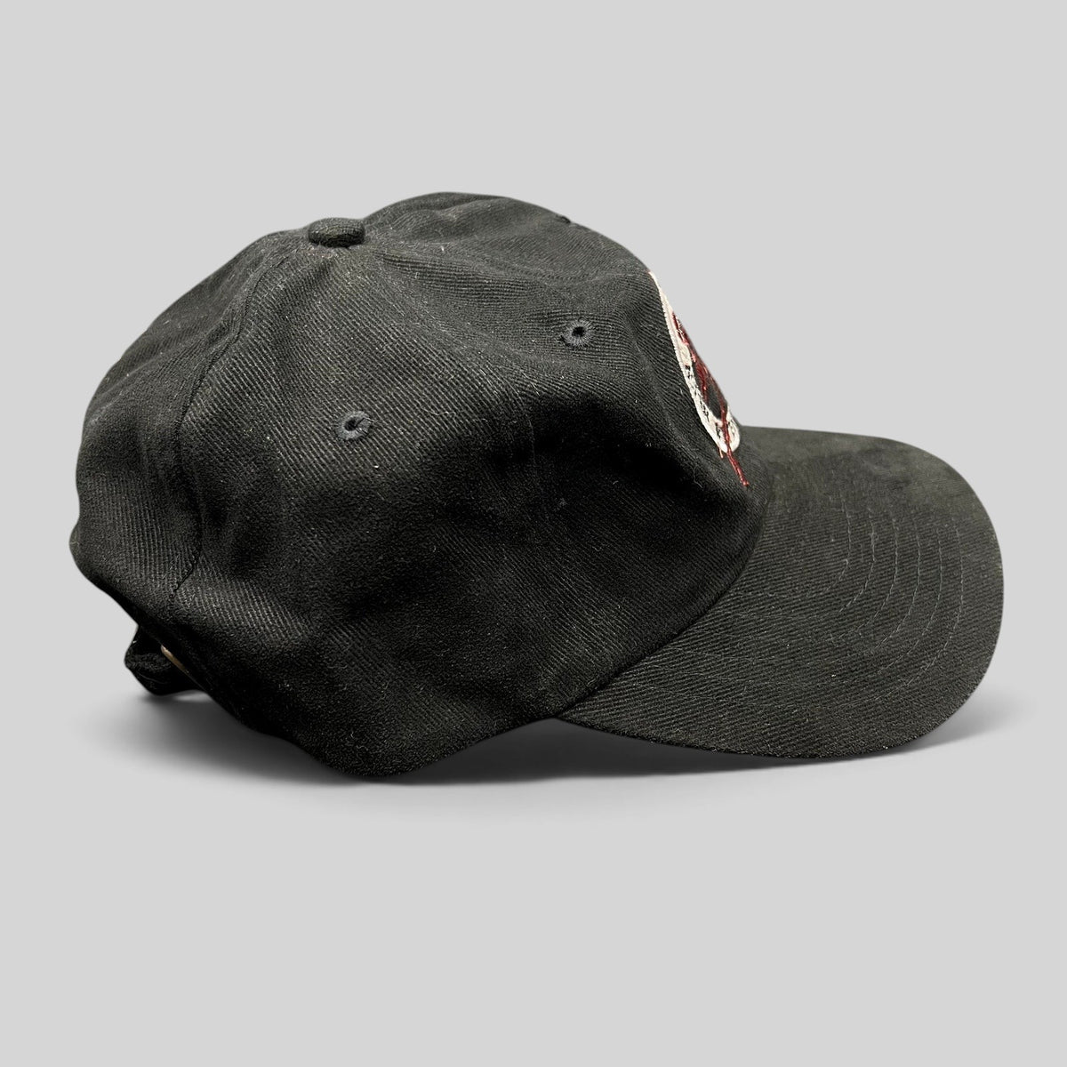 Raree Finds vintage black Y2K Aspen Winternational 2000 Chevy Trucks strapback ski hat with embroidered skier logo.