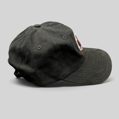 Raree Finds vintage black Y2K Aspen Winternational 2000 Chevy Trucks strapback ski hat with embroidered skier logo.