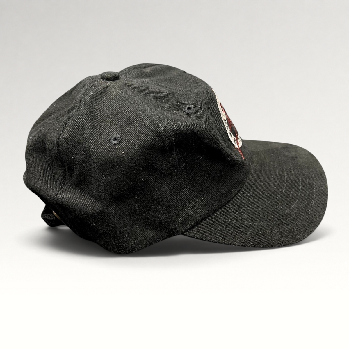 Raree Finds vintage black Y2K Aspen Winternational 2000 Chevy Trucks strapback ski hat with embroidered skier logo.