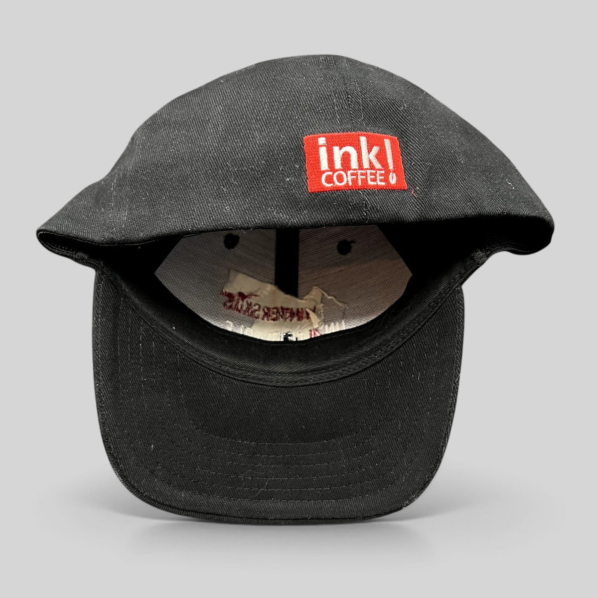 Raree Finds black 2004 Aspen Wintersköl stretch-fit cap featuring Ink! Coffee logo embroidery on the side