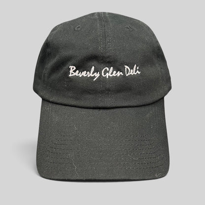Raree Finds black cotton strapback hat with white Beverly Glen Deli cursive script embroidery on the front