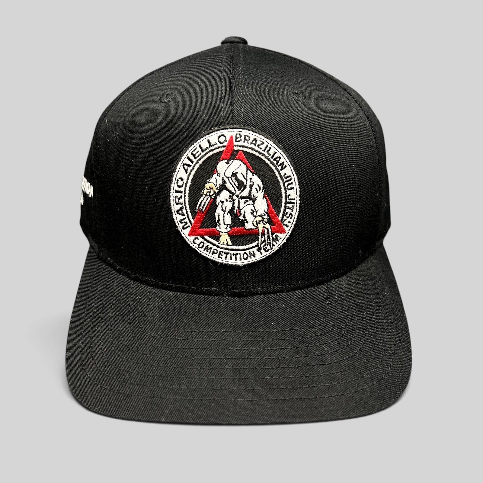 Raree Finds black Yupoong snapback hat with Mario Aiello Brazilian Jiu Jitsu Competition Team embroidered patch