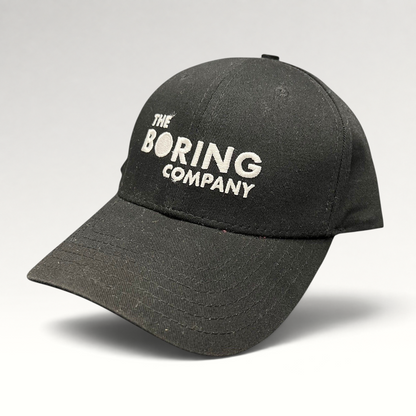 Raree Finds black The Boring Company strapback hat with white embroidered logo on the front and curved brim