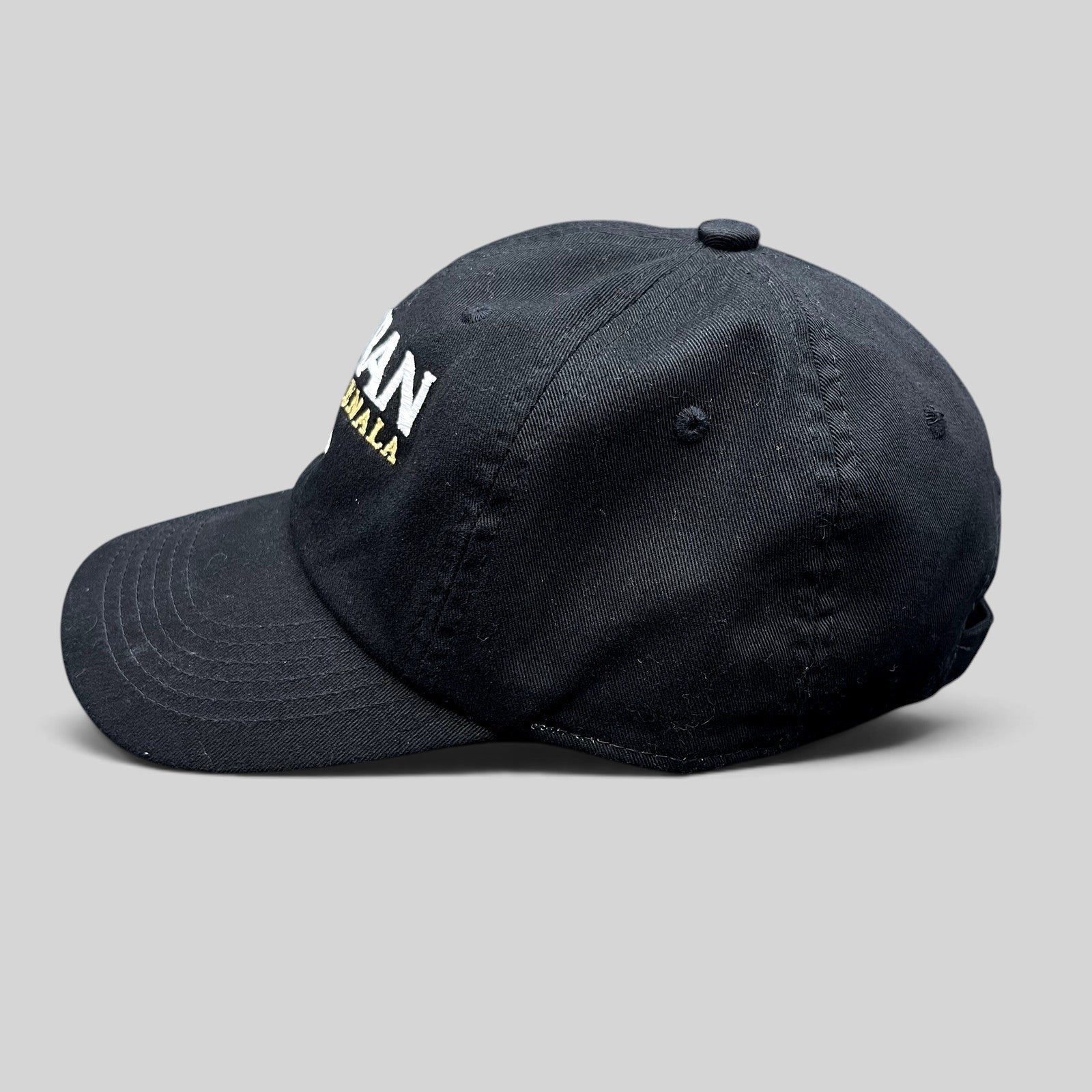 Raree Finds black cotton strapback hat with Botran Ron de Guatemala No. 18 embroidery in white and gold