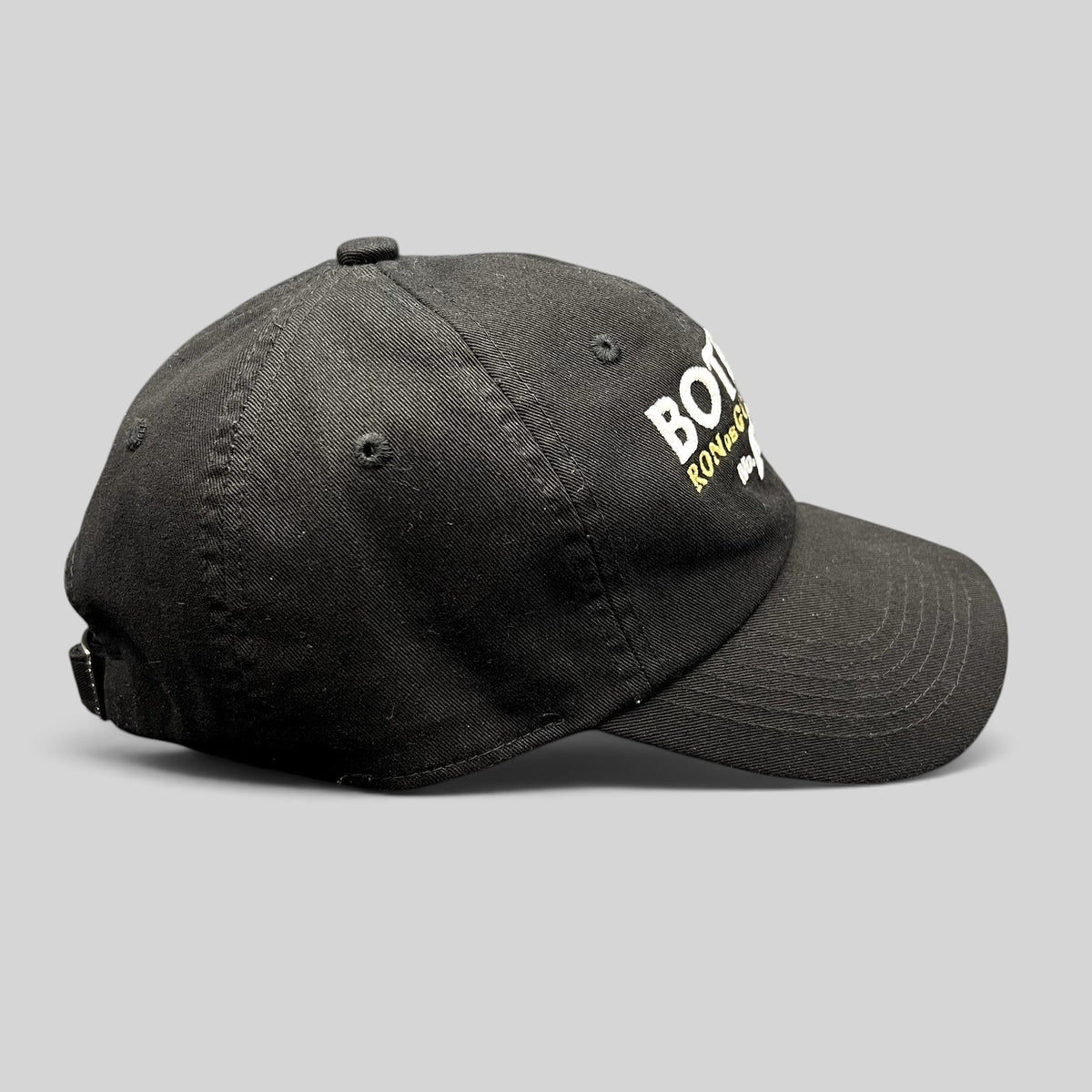 Raree Finds black cotton strapback hat with Botran Ron de Guatemala No. 18 embroidery on the front