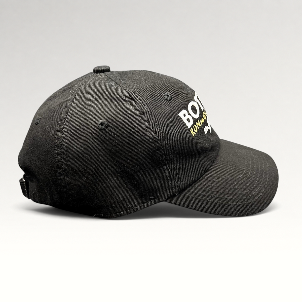 Raree Finds black cotton strapback hat with Botran Ron de Guatemala No. 18 embroidery on the front