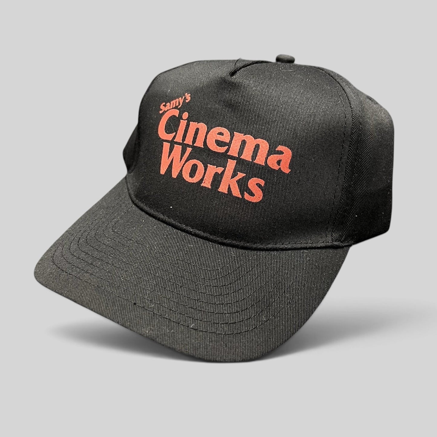 Raree Finds black cotton twill strapback hat with red Samy's CinemaWorks film production logo embroidery