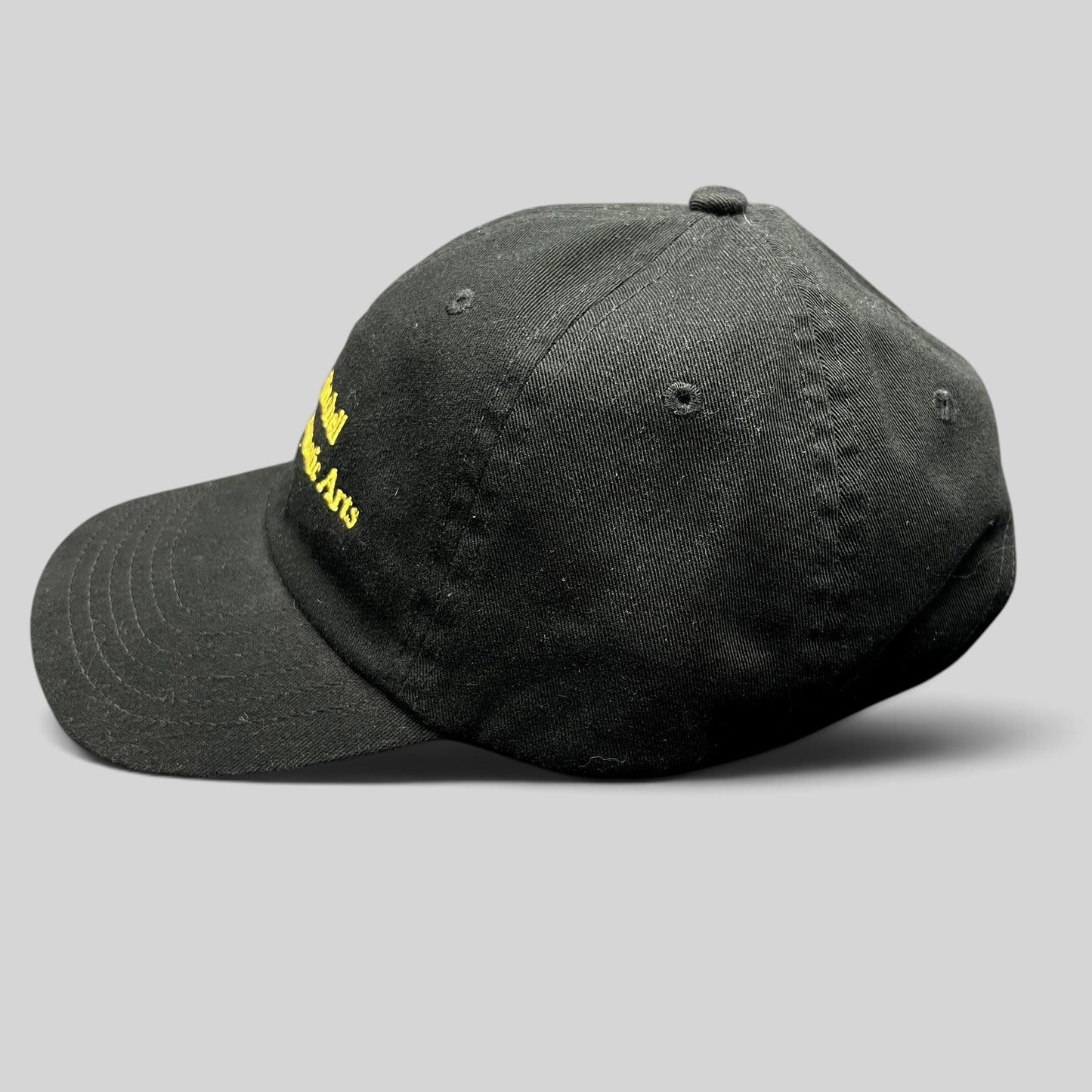 Raree Finds black cotton strapback hat with gold embroidered John H. Mitchell Business of Cinematic Arts lettering.