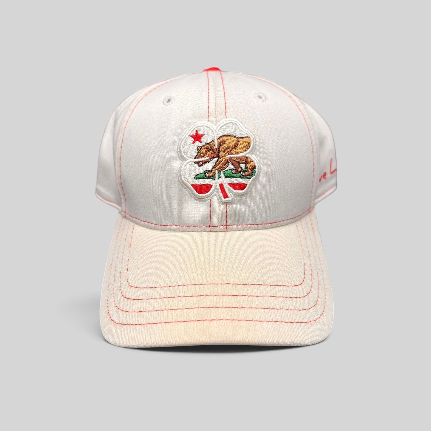Raree Finds Black Clover California Republic hat featuring a bear and four-leaf clover embroidery on white fabric.