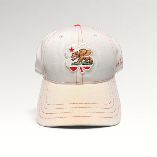 Raree Finds Black Clover California Republic hat featuring a bear and four-leaf clover embroidery on white fabric.