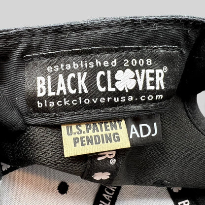 Raree Finds Black Clover hat interior label with U.S. Patent Pending tag and branded taping