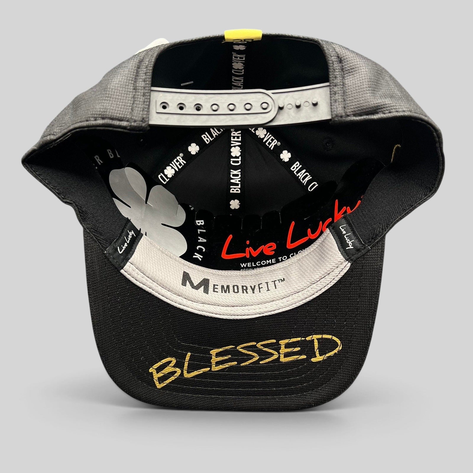 Raree Finds Black Clover x Tony Robbins 2026 snapback hat showing the underside of the brim with Blessed embroidery