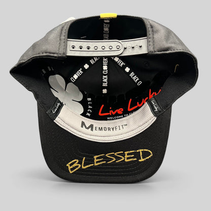 Raree Finds Black Clover x Tony Robbins 2026 snapback hat showing the underside of the brim with Blessed embroidery