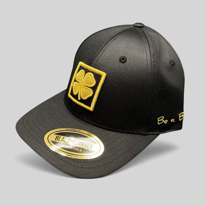Raree Finds Black Clover x Tony Robbins 2026 limited edition black snapback hat with gold clover patch and embroidery