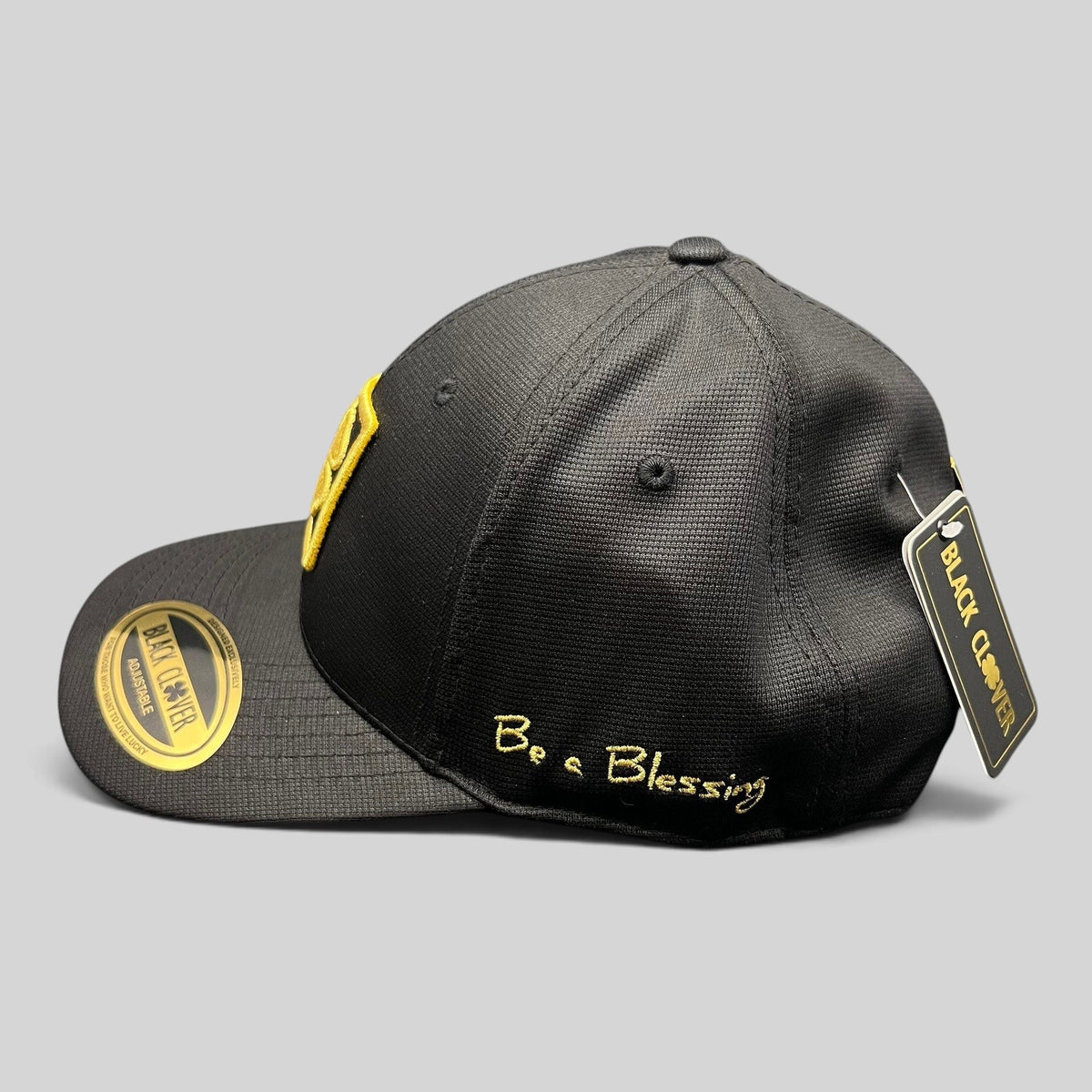 Raree Finds Black Clover x Tony Robbins 2026 black snapback hat with gold clover patch and Blessed embroidery