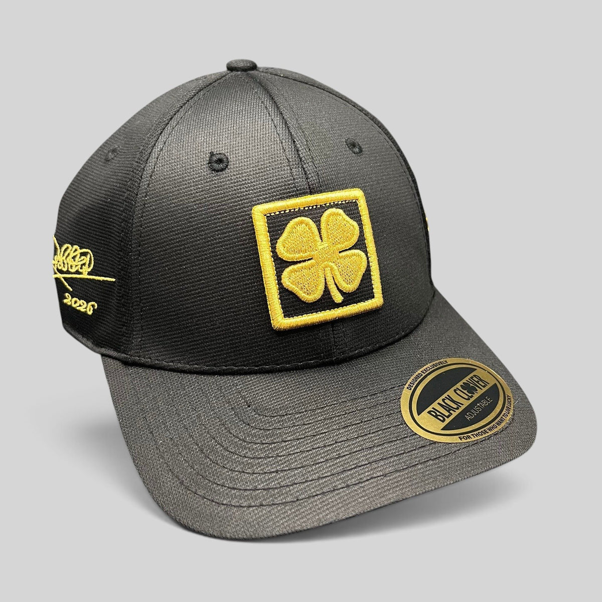 Raree Finds Black Clover x Tony Robbins 2026 limited edition black snapback hat with gold clover patch and embroidery.