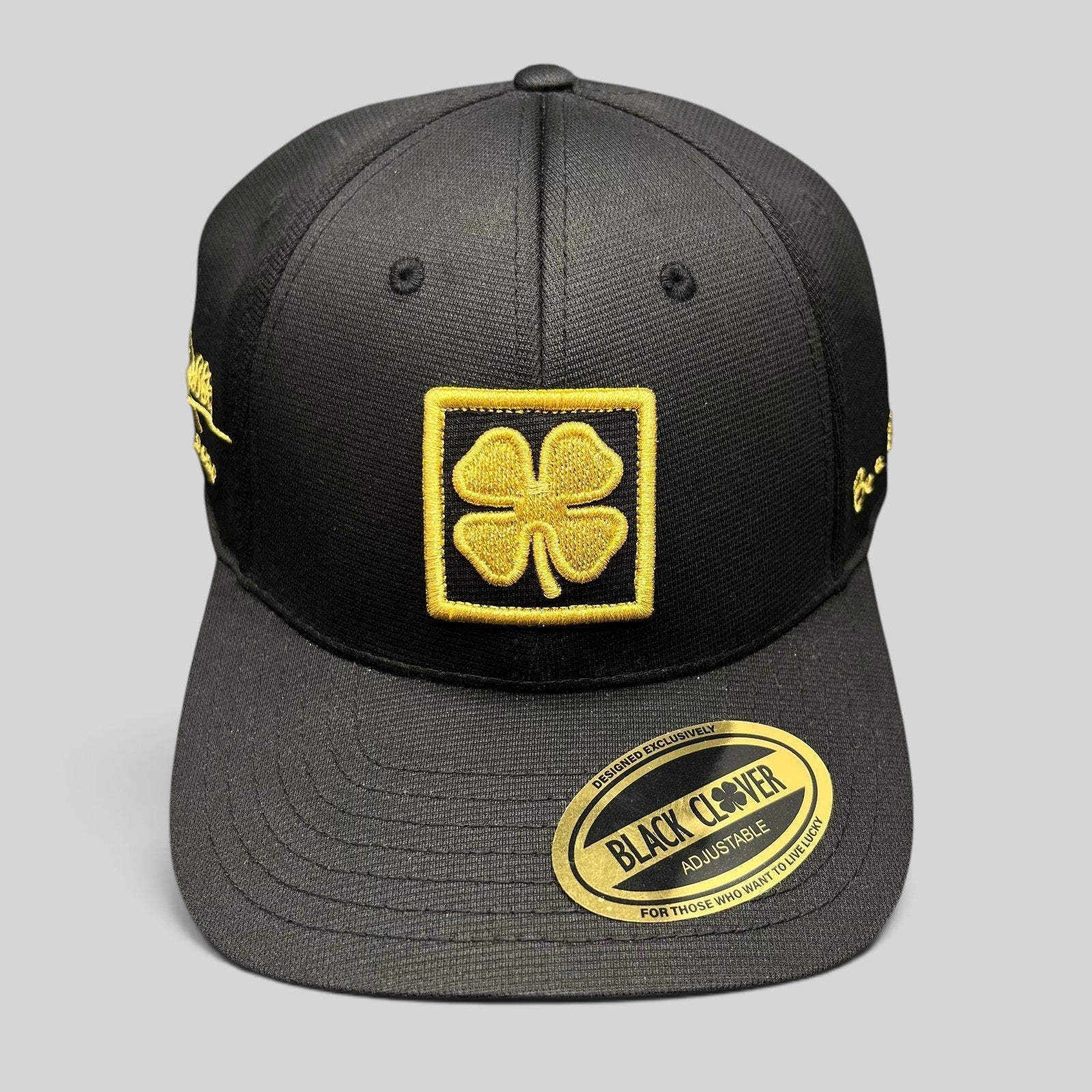Raree Finds Black Clover x Tony Robbins 2026 limited edition black snapback hat with gold clover patch and embroidery