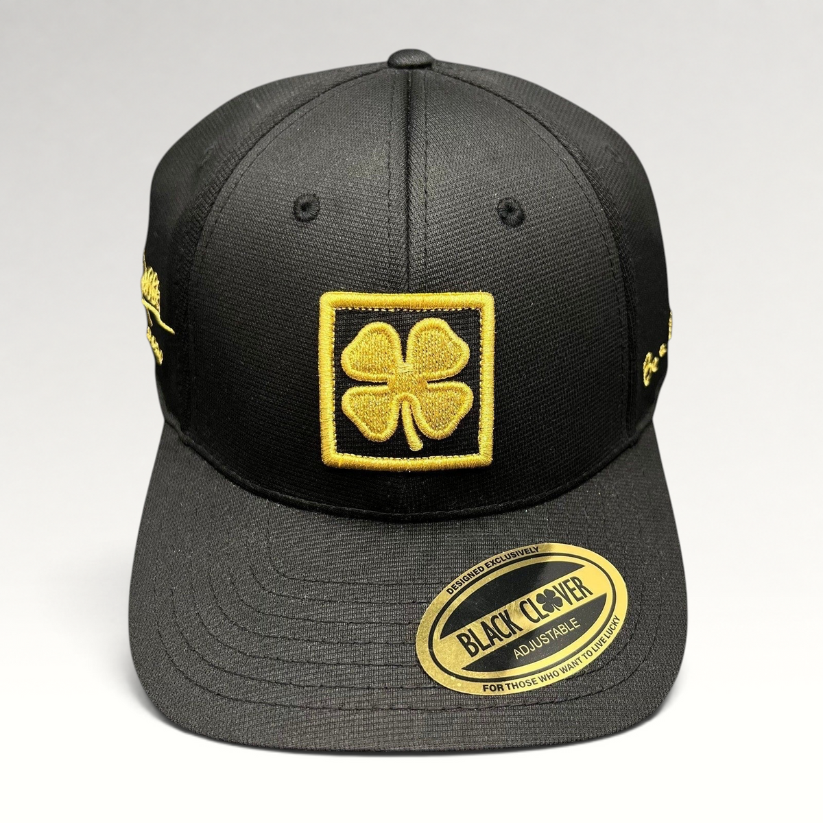 Raree Finds Black Clover x Tony Robbins 2026 limited edition black snapback hat with gold clover patch and embroidery