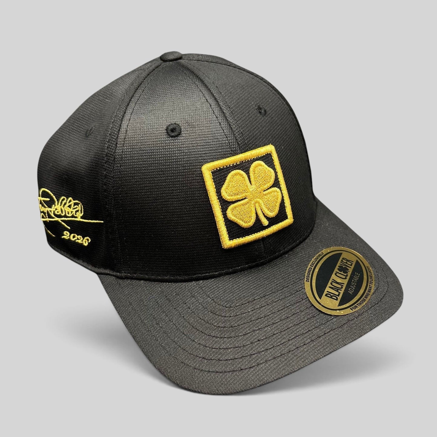 Raree Finds Black Clover x Tony Robbins 2026 limited edition black snapback hat with gold clover patch and embroidery