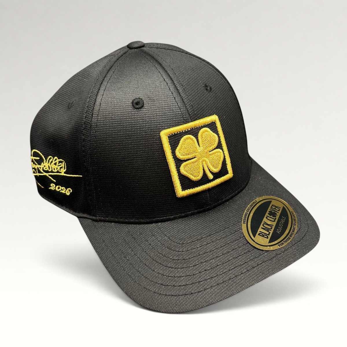 Raree Finds Black Clover x Tony Robbins 2026 limited edition black snapback hat with gold clover patch and embroidery