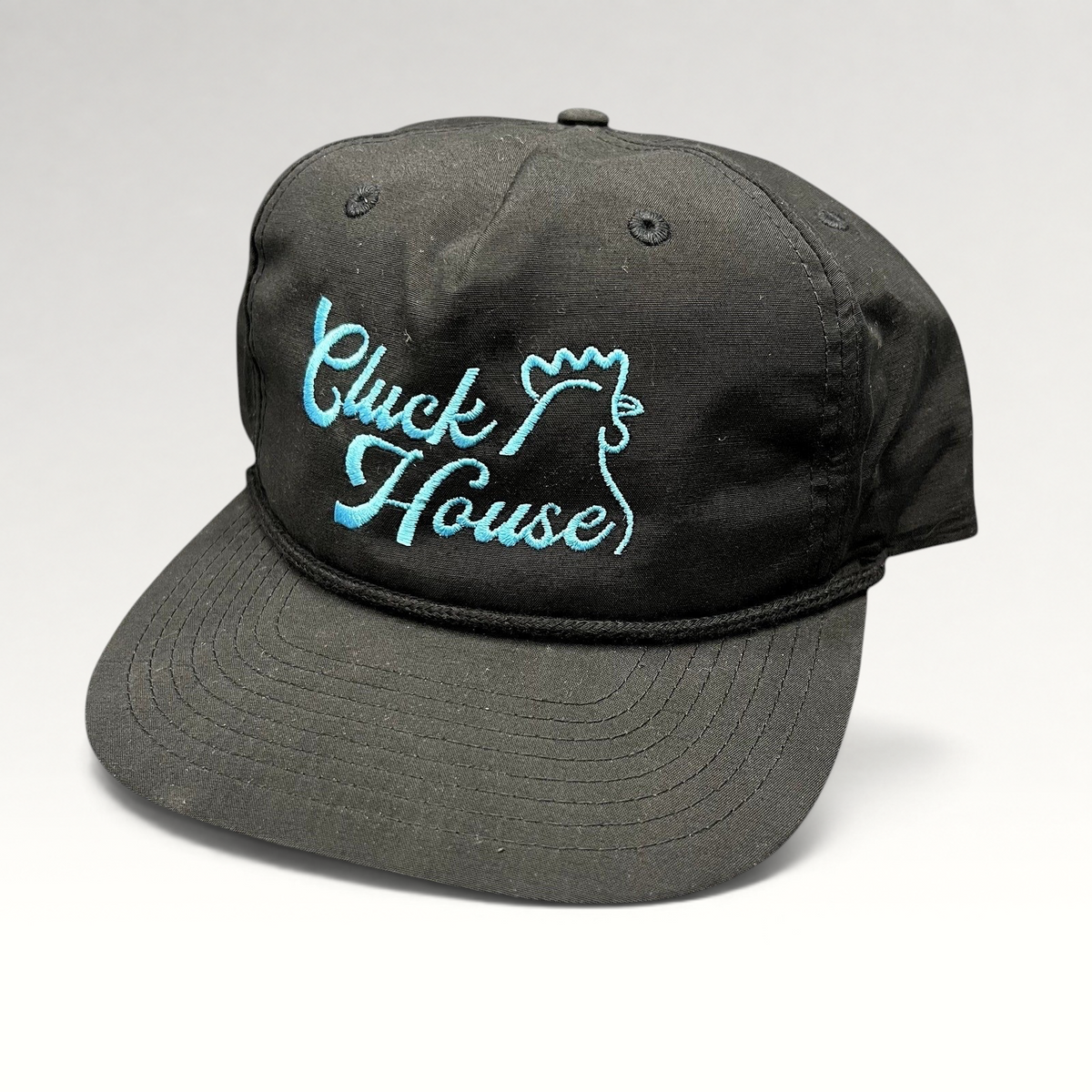 Raree Finds black Richardson Outdoor snapback hat with aqua blue Cluck House rooster embroidery and rope brim detail.