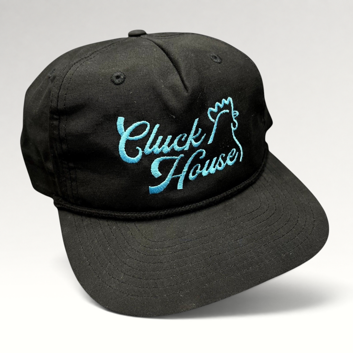 Raree Finds black Richardson Outdoor snapback hat with aqua blue Cluck House script embroidery and front rope detail.