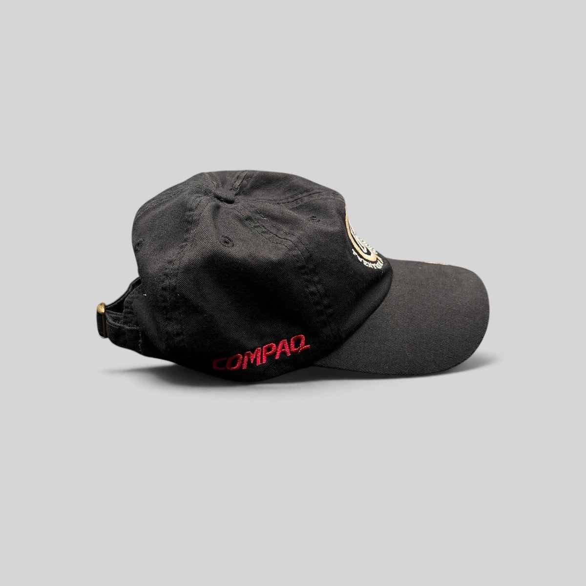 Raree Finds black cotton promotional hat with side Compaq embroidery and adjustable brass buckle strap